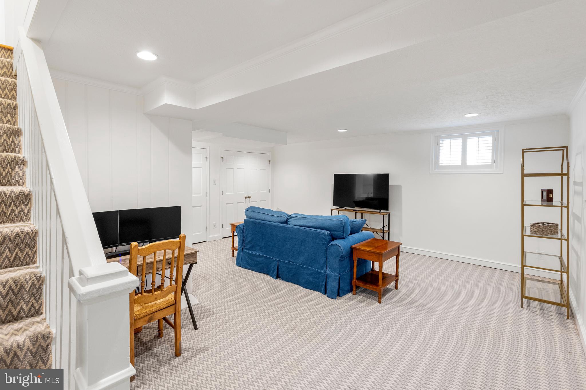 3303 Rolling Road Chevy Chase, MD 20815 - Photo 32 of 51 a living room with furniture and a flat screen tv