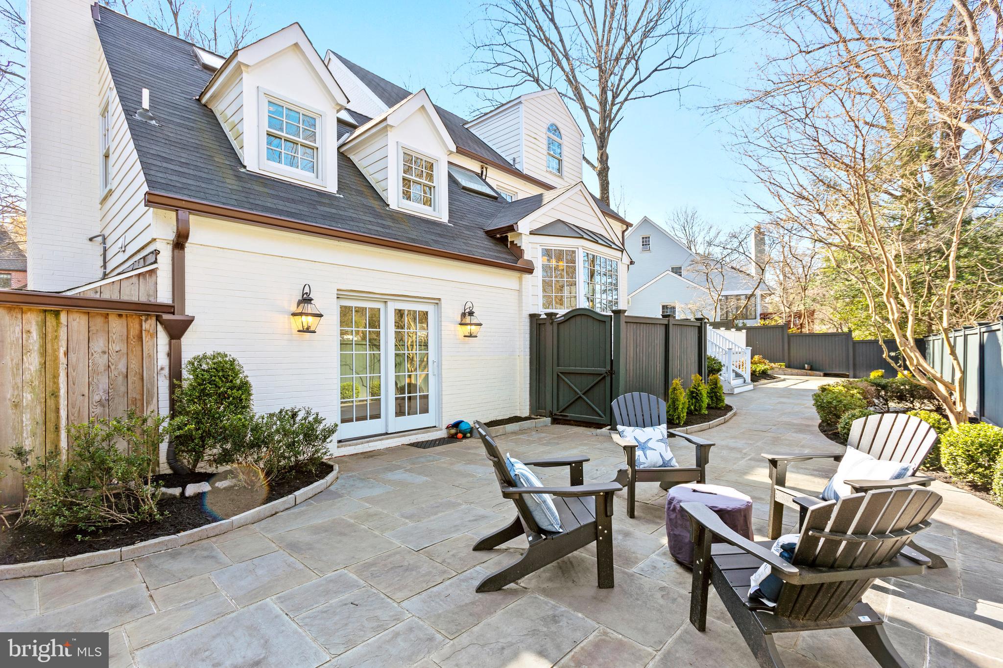 3303 Rolling Road Chevy Chase, MD 20815 - Photo 35 of 51 a view of a patio with a table and chairs and potted plants