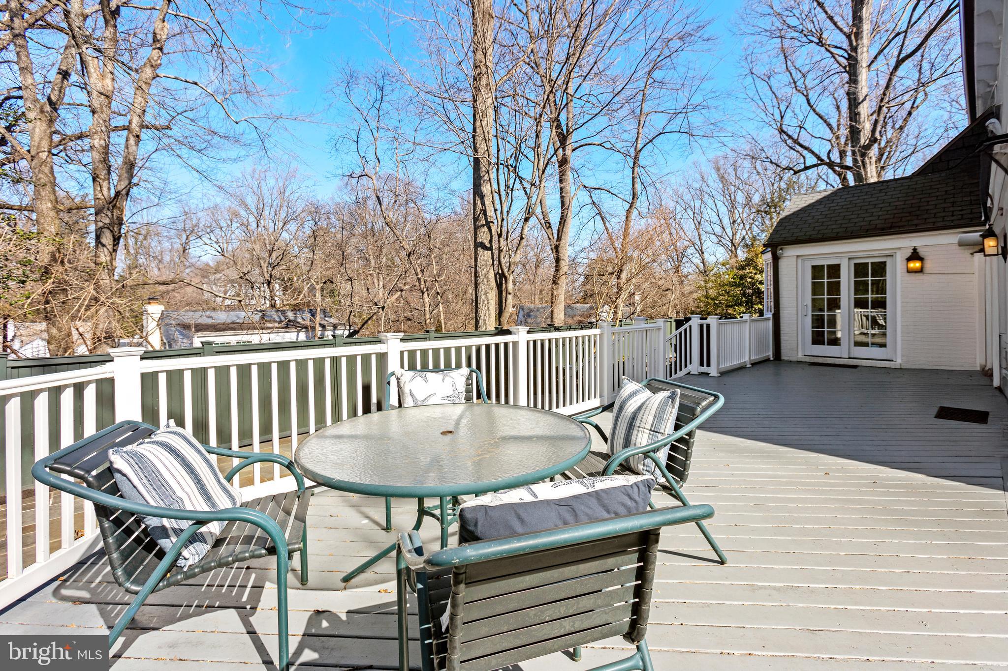 3303 Rolling Road Chevy Chase, MD 20815 - Photo 36 of 51 a view of a chairs and table on the wooden floor