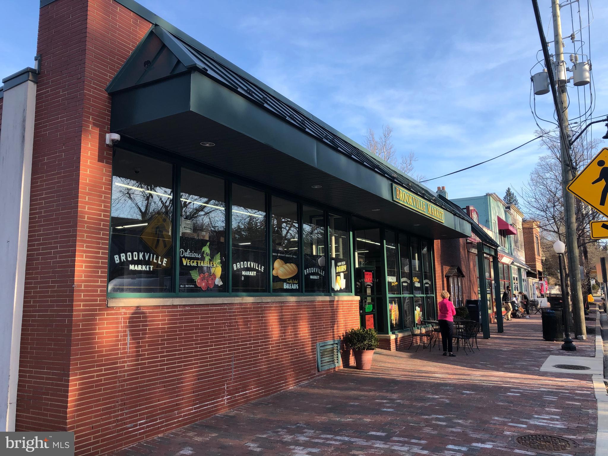 3303 Rolling Road Chevy Chase, MD 20815 - Photo 41 of 51 a view of path along with retail shop and outdoor seating