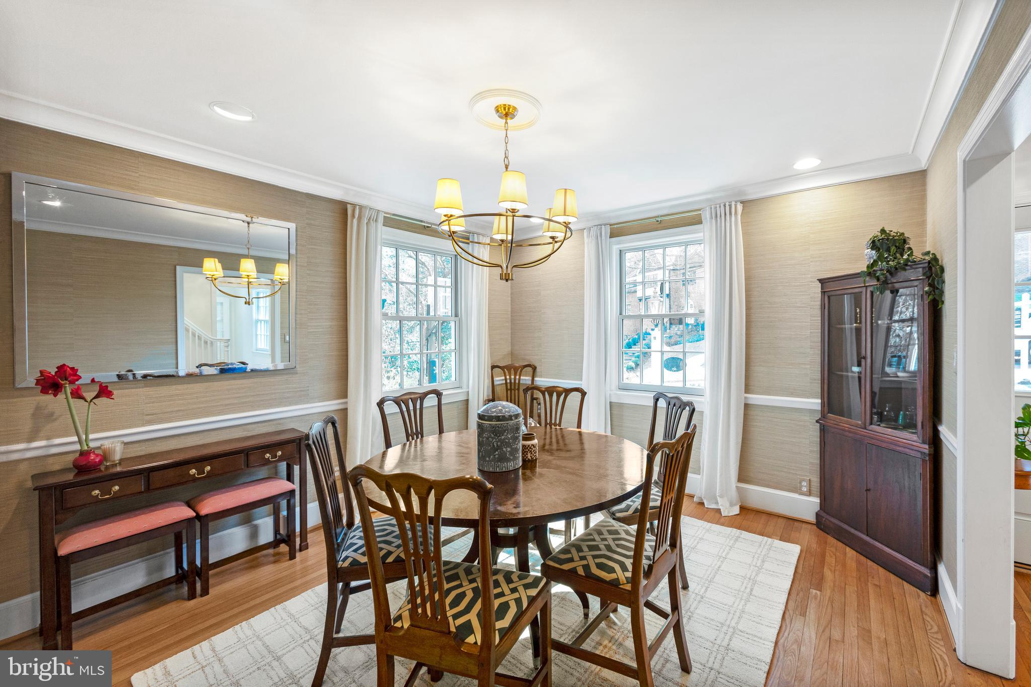 3303 Rolling Road Chevy Chase, MD 20815 - Photo 5 of 51 a view of a dining room with furniture window and wooden floor