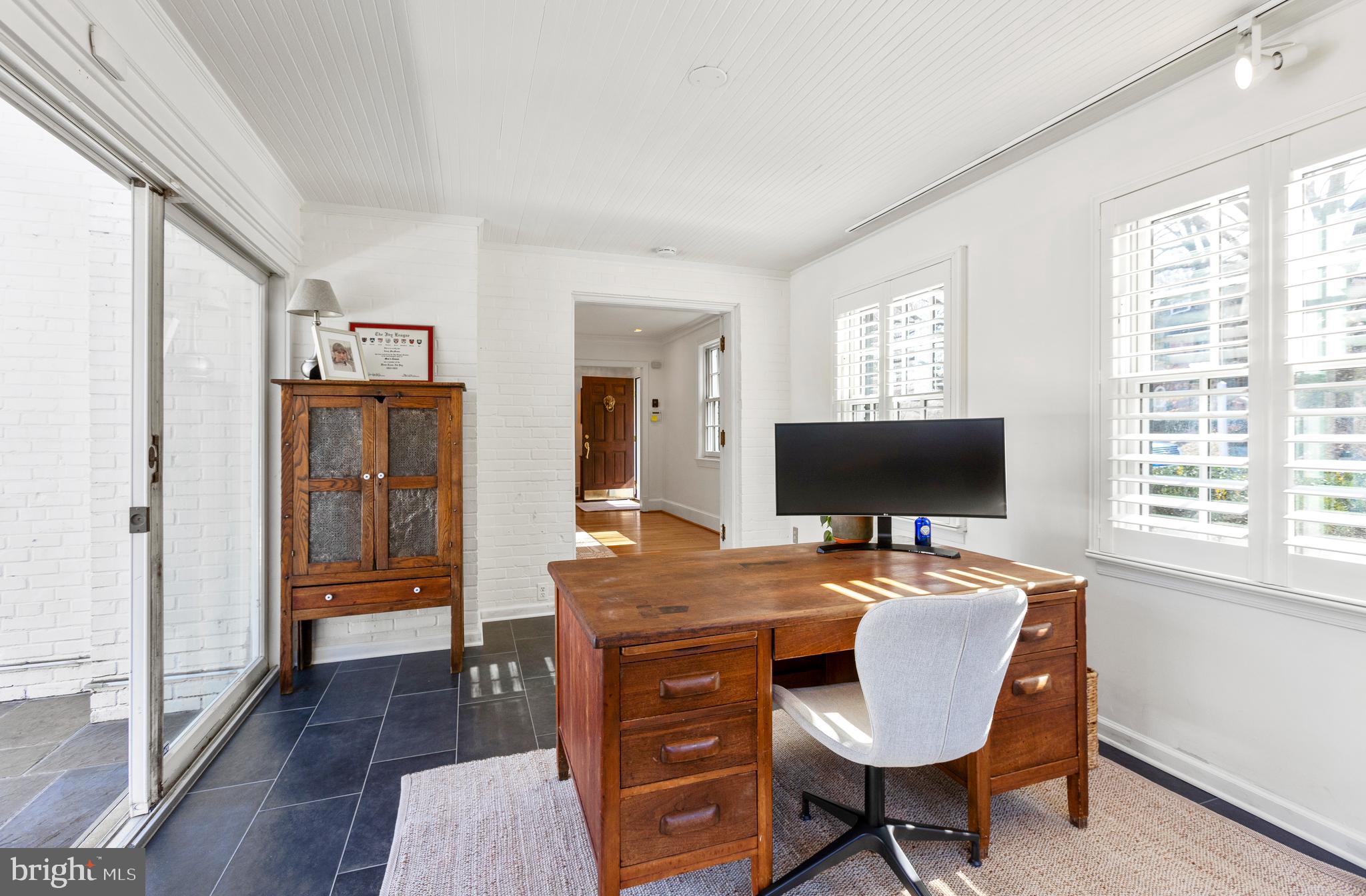 3303 Rolling Road Chevy Chase, MD 20815 - Photo 7 of 51 a workspace with furniture and window