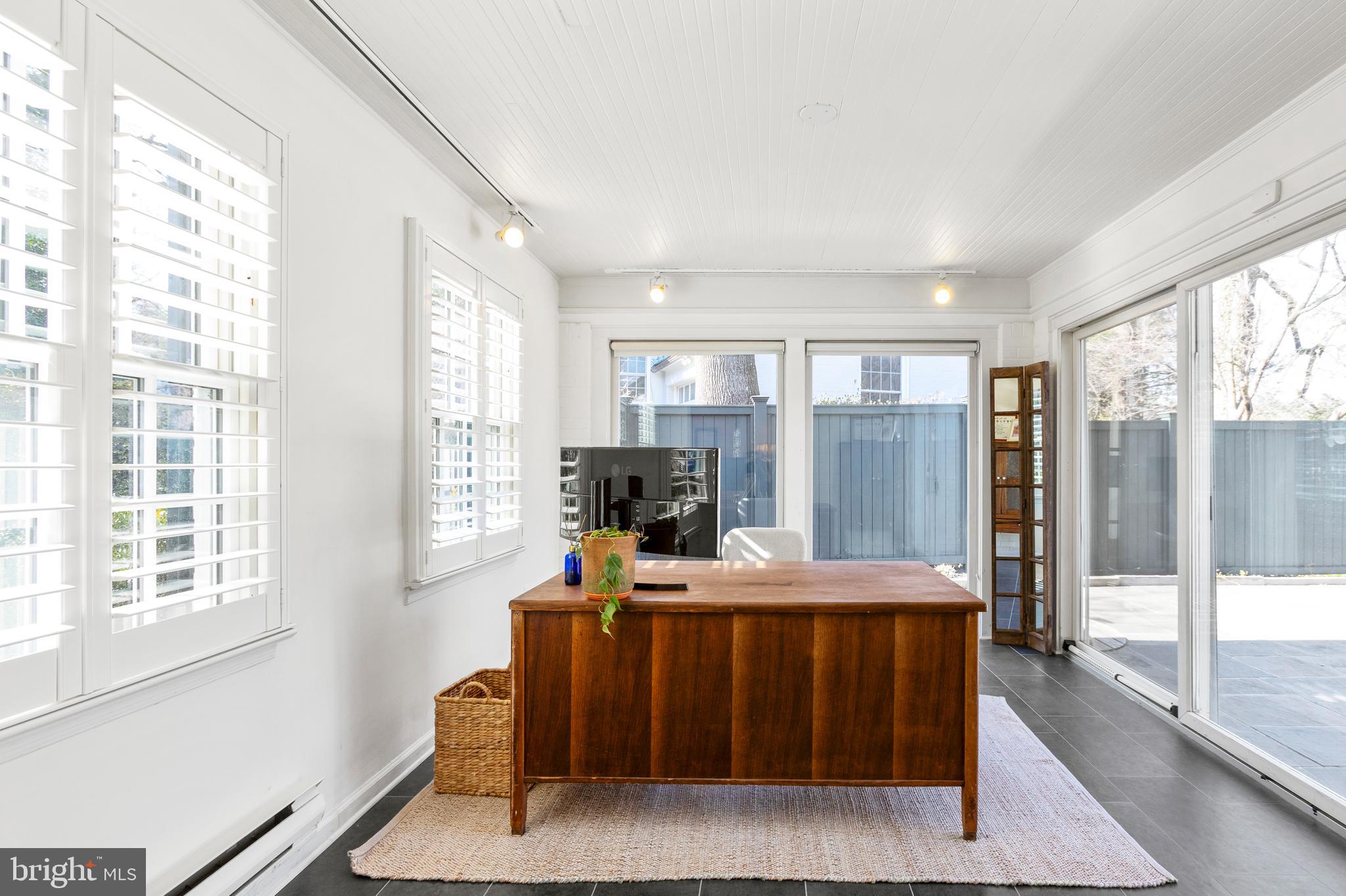 3303 Rolling Road Chevy Chase, MD 20815 - Photo 8 of 51 a room with furniture and large window