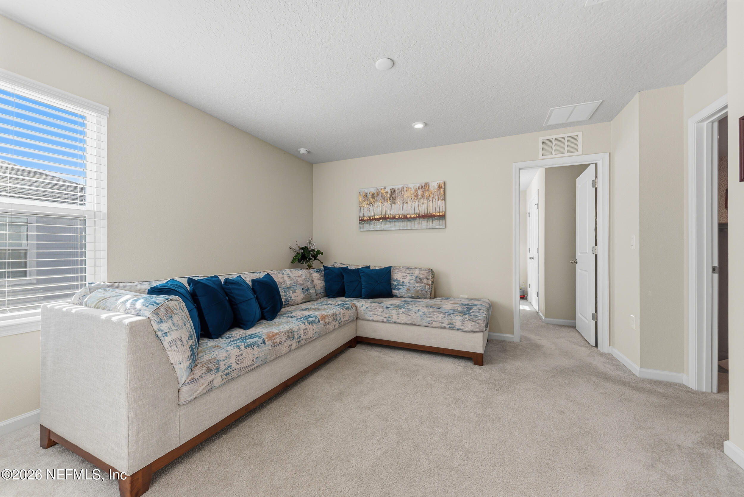 1052 Victoria Hills Jacksonville, FL 32221 - Photo 13 of 27 a living room with furniture and a window
