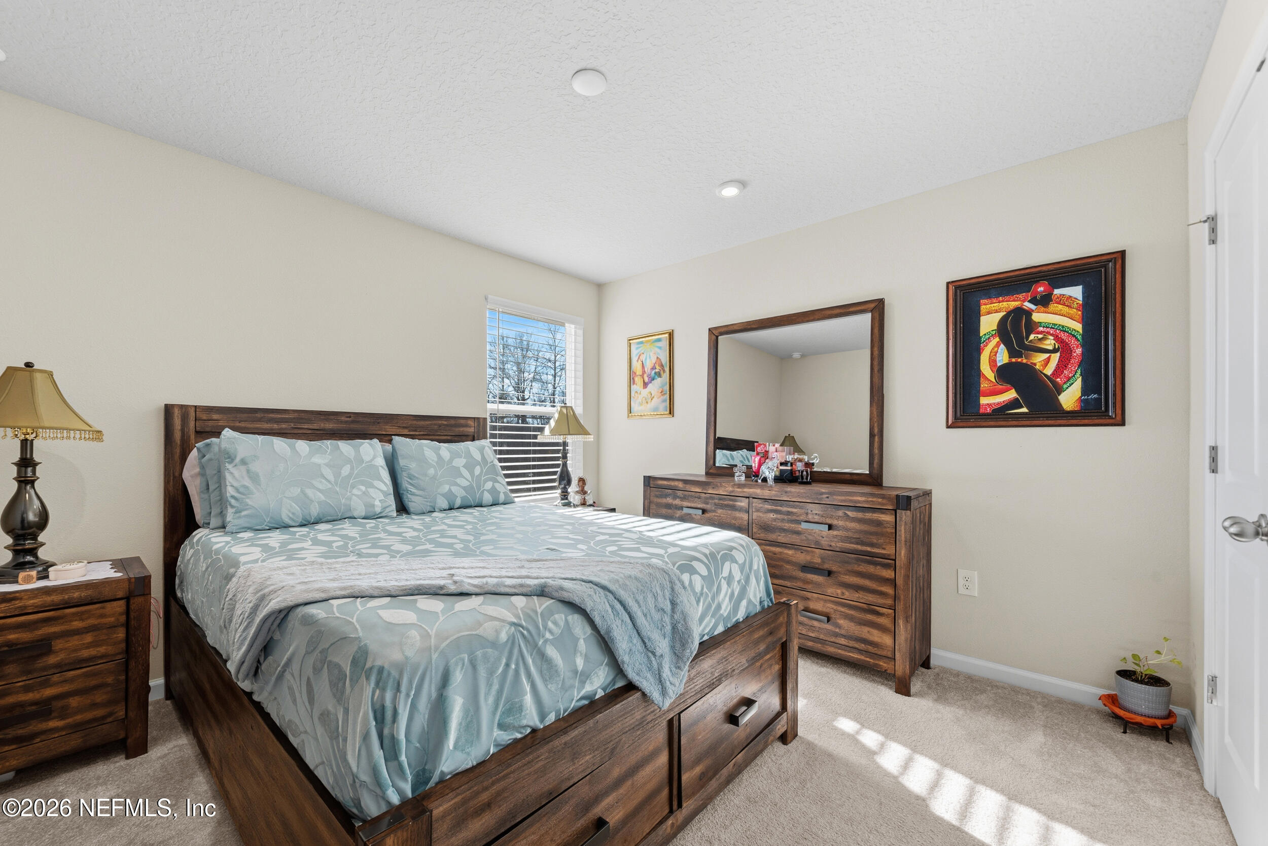 1052 Victoria Hills Jacksonville, FL 32221 - Photo 15 of 27 a bedroom with a bed and a dresser in it