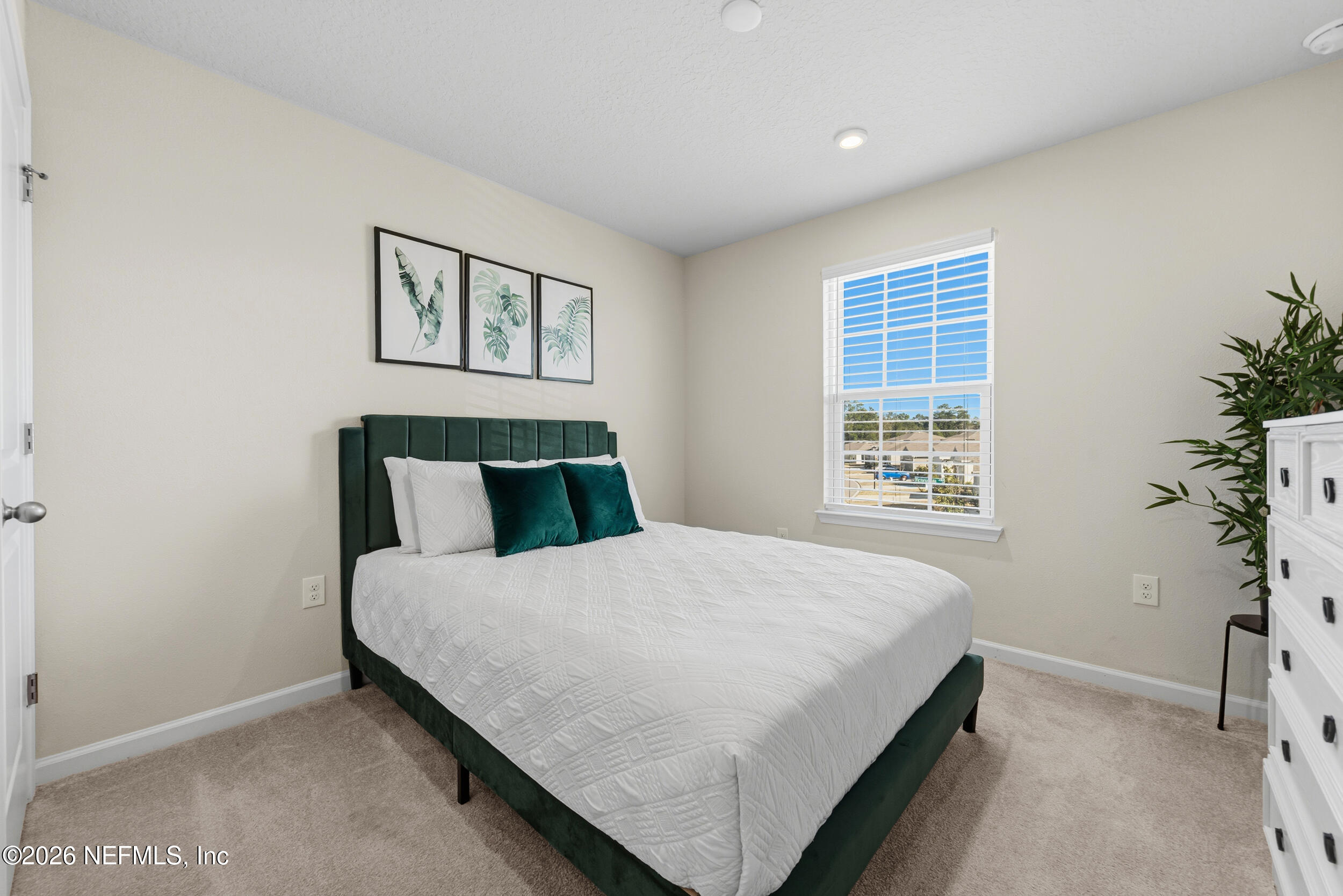 1052 Victoria Hills Jacksonville, FL 32221 - Photo 17 of 27 a bedroom with a bed and a window