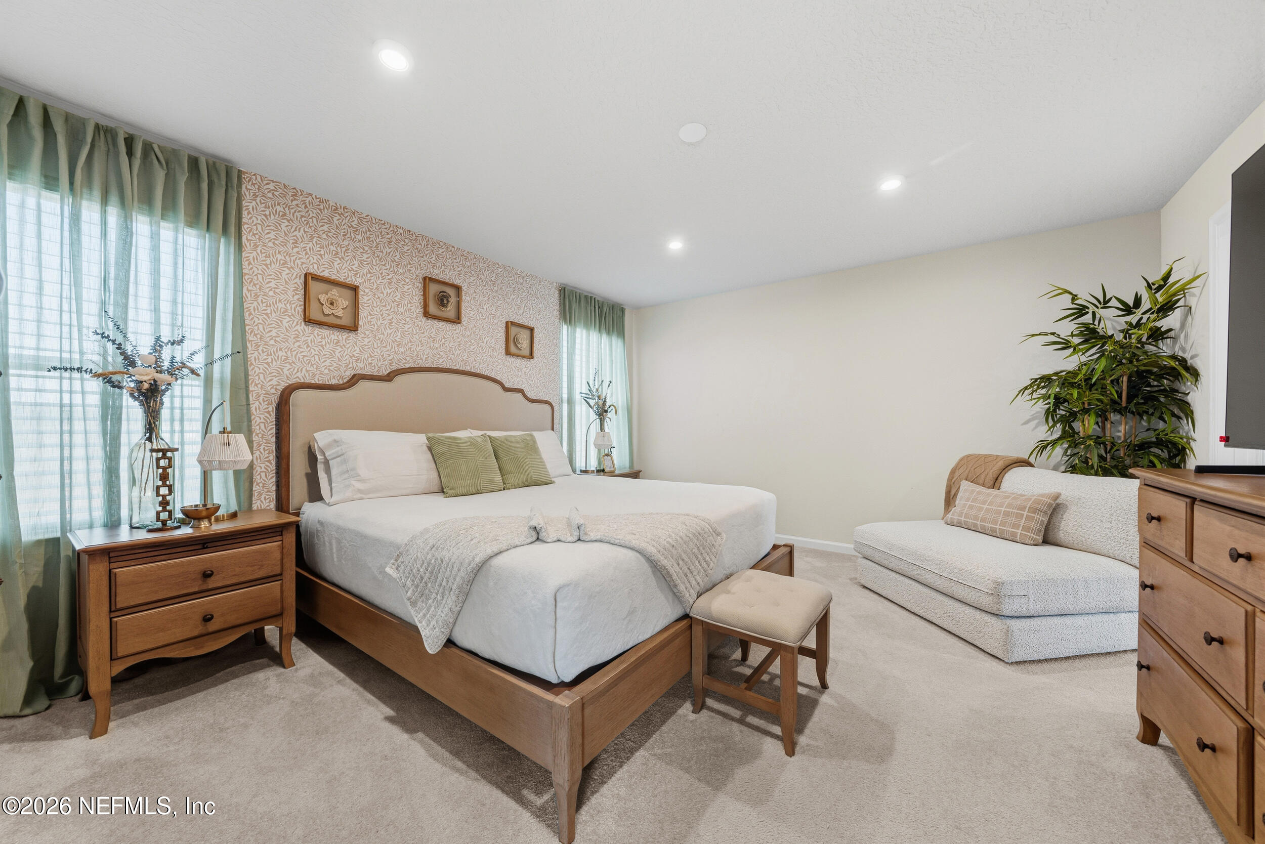 1052 Victoria Hills Jacksonville, FL 32221 - Photo 9 of 27 a bedroom with a bed and a couch