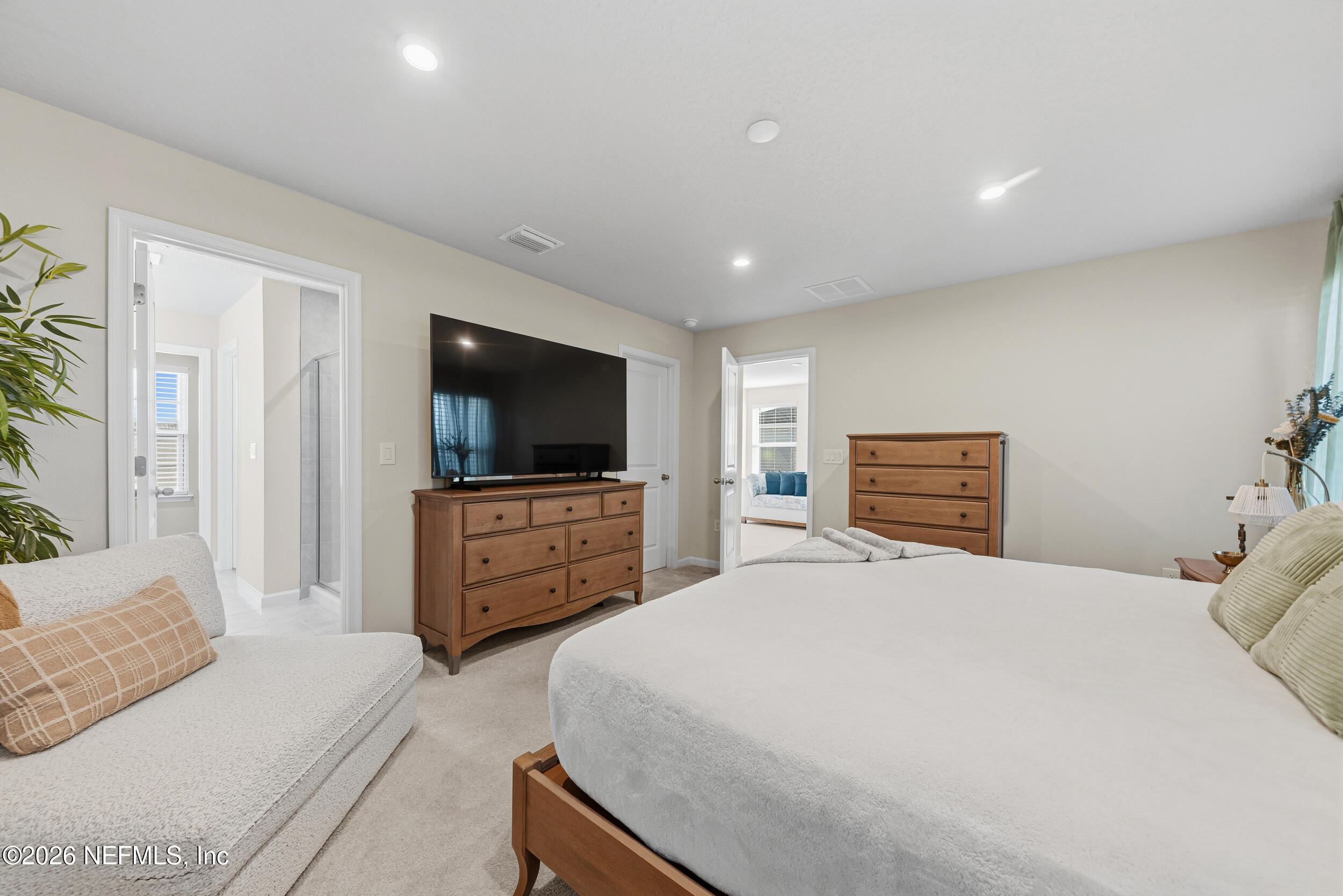 1052 Victoria Hills Jacksonville, FL 32221 - Photo 10 of 27 a bedroom with a bed and a flat screen tv