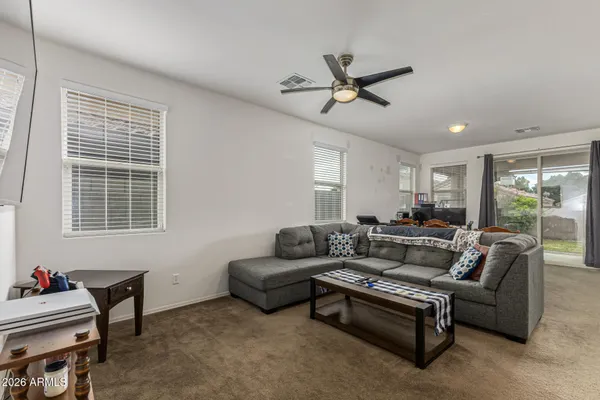 a living room with furniture and a window
