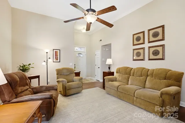 a view of a dining room with furniture and a kitchen