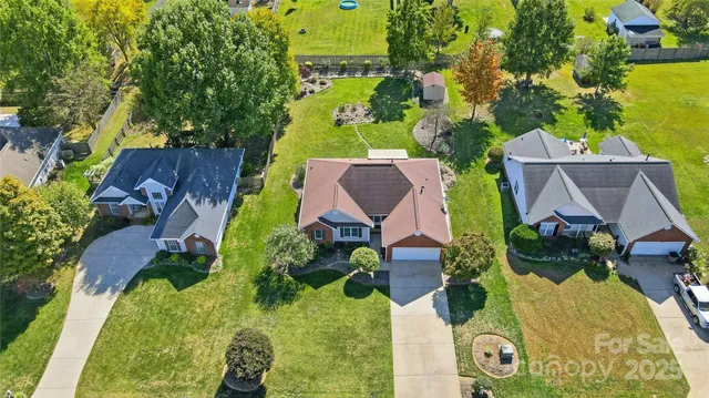 an aerial view of house with yard swimming pool and outdoor seating