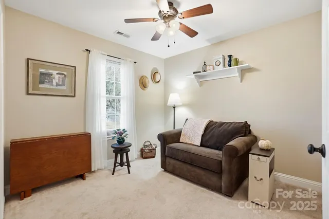 a living room with furniture and a window