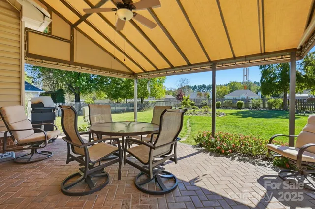 a view of a chairs and table in a patio