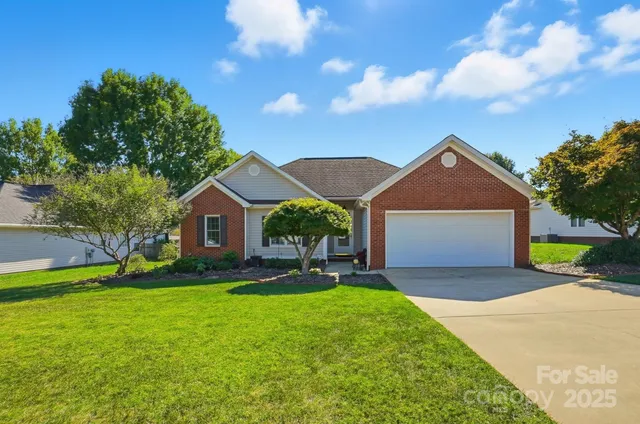 a view of a two chairs in front of the house