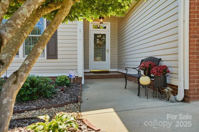 a view of a bathroom with sink mirror and window