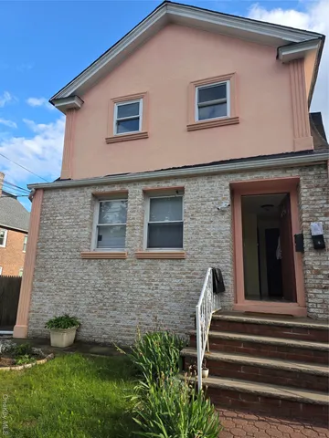 a view of a house with a yard and sitting space