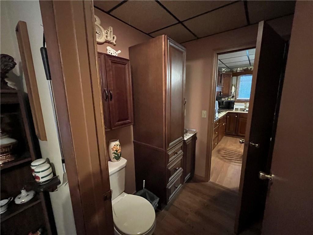 792 Main Street Anita, PA 15711 - Photo 12 of 16 a bathroom with a toilet mirror vanity and tub