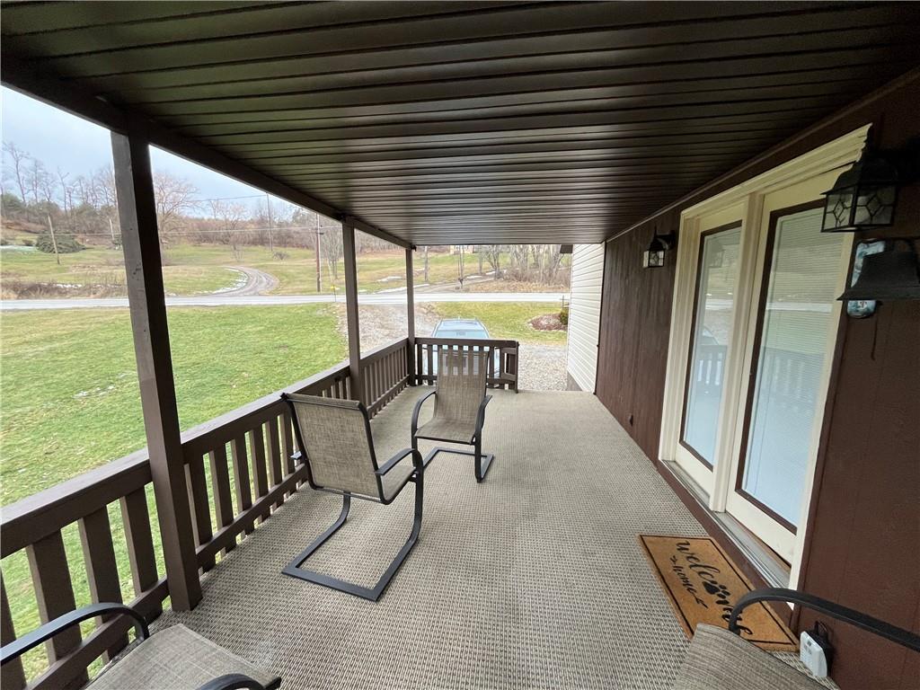 792 Main Street Anita, PA 15711 - Photo 6 of 16 a view of an chairs and table in the balcony