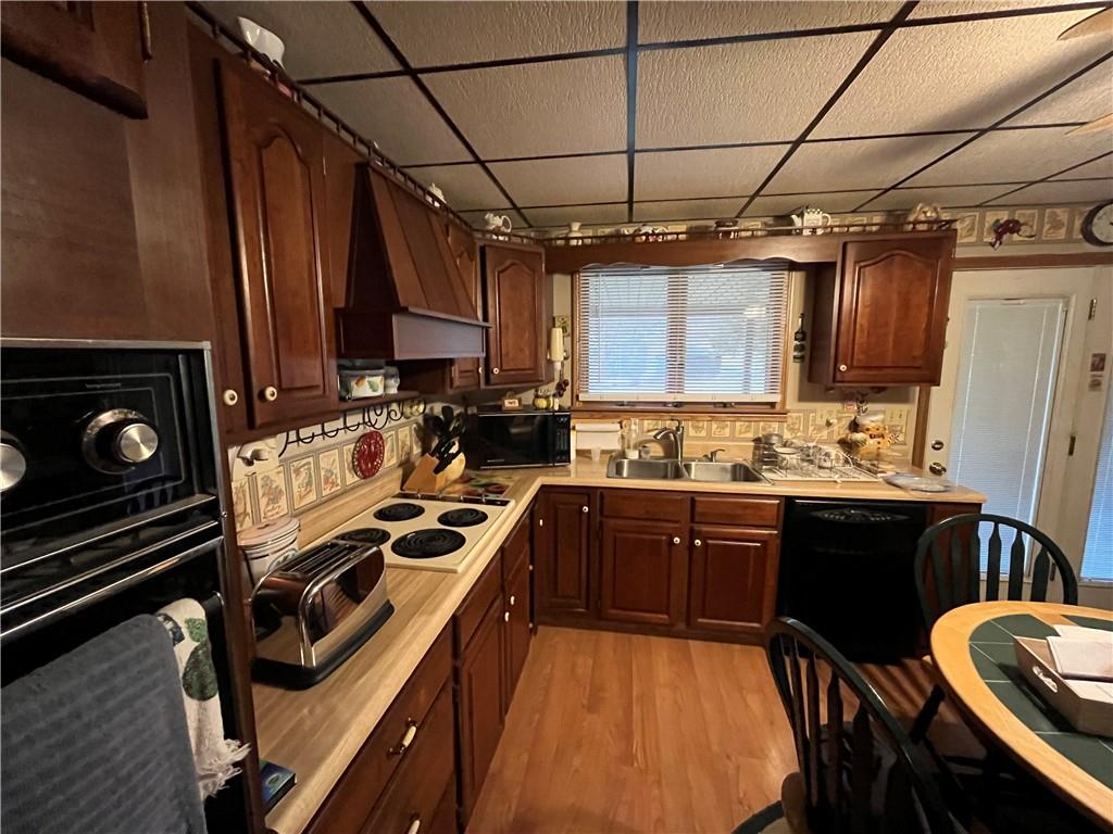 792 Main Street Anita, PA 15711 - Photo 7 of 16 a kitchen with stainless steel appliances granite countertop a sink stove and refrigerator