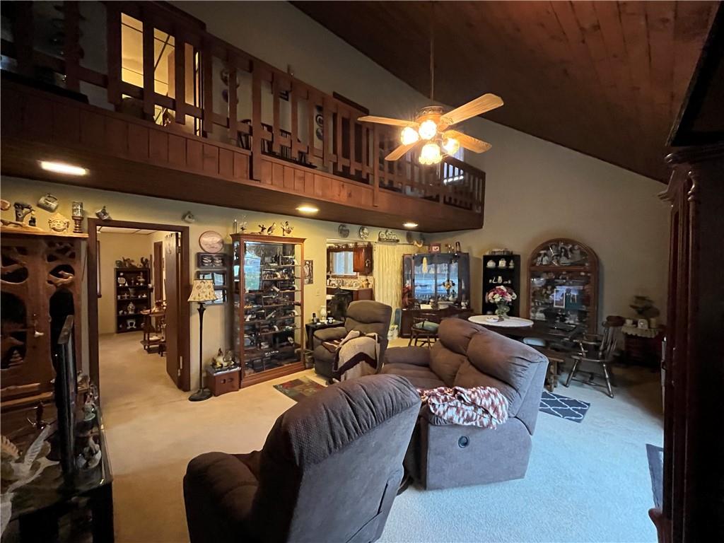 792 Main Street Anita, PA 15711 - Photo 10 of 16 a living room with furniture a chandelier and a window