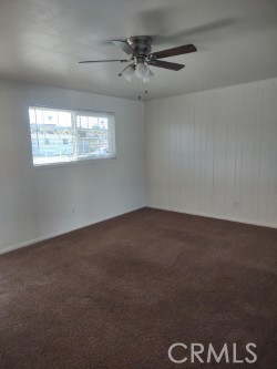 1121 Mojave Drive Barstow, CA 92311 - Photo 4 of 9 an empty room with a window