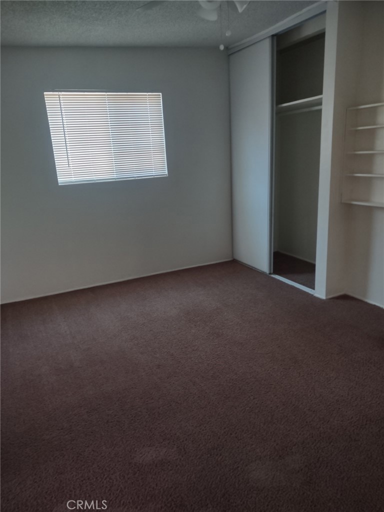 1121 Mojave Drive Barstow, CA 92311 - Photo 8 of 9 an empty room with windows