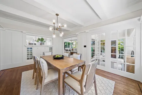 a kitchen with stainless steel appliances granite countertop wooden cabinets a sink and dishwasher a stove a refrigerator with wooden cabinets