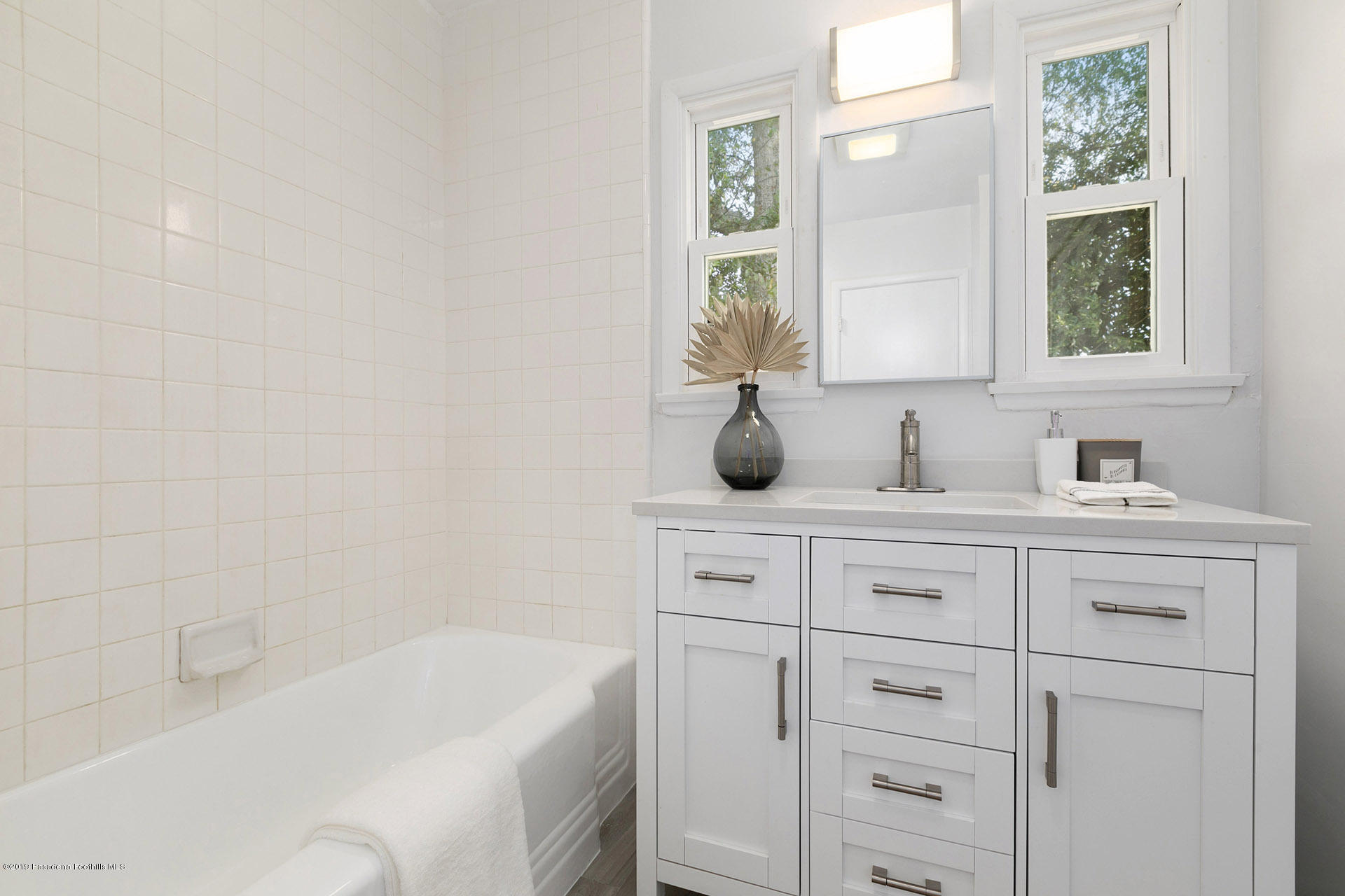 3300 Calvert Road Pasadena, CA 91107 - Photo 21 of 26 a bathroom with a sink and a bathtub