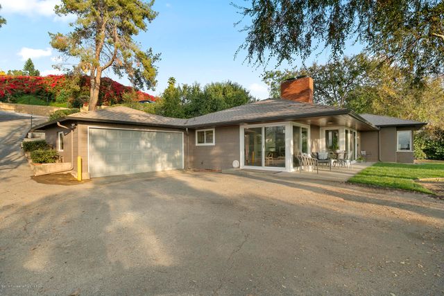 front view of a house with a garden