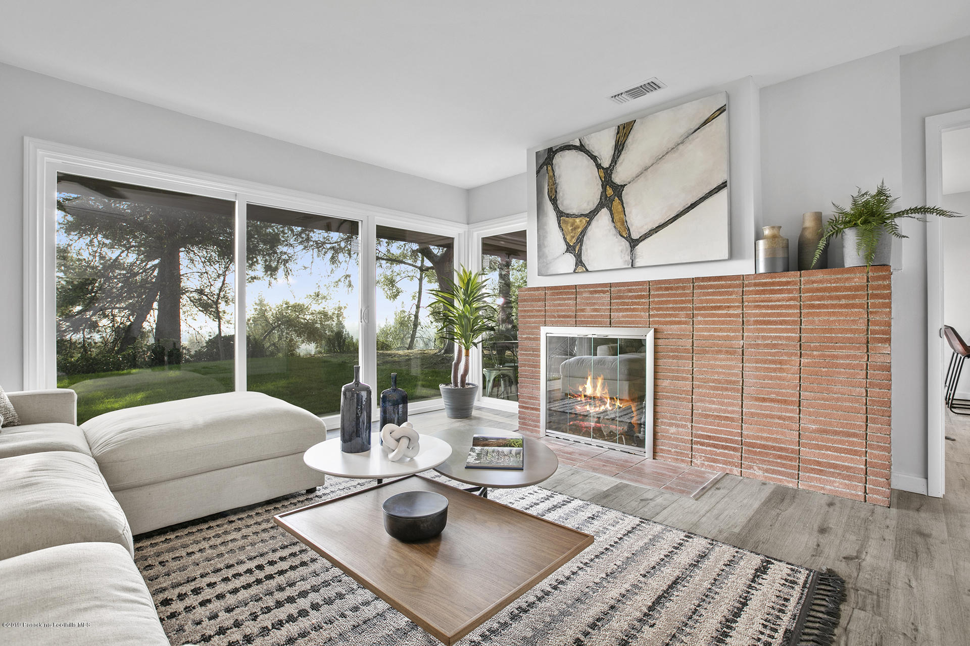 3300 Calvert Road Pasadena, CA 91107 - Photo 5 of 26 a living room with furniture and a fireplace