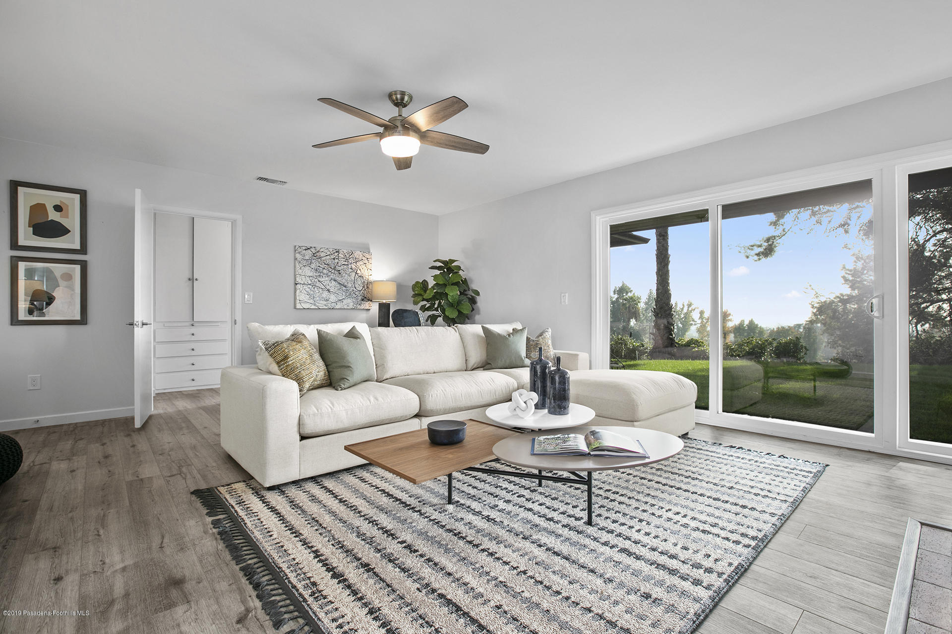 3300 Calvert Road Pasadena, CA 91107 - Photo 8 of 26 a living room with couch a table and a window