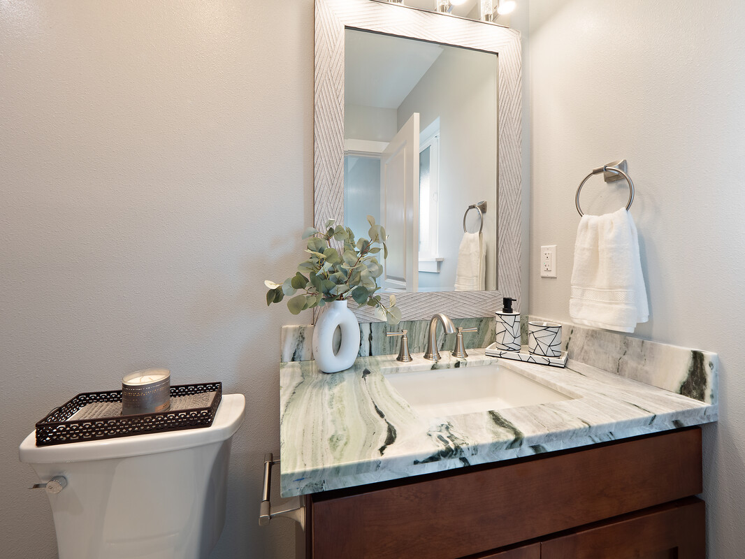 11-3155 Volcano Road Volcano, HI 96785 - Photo 11 of 25 a bathroom with a granite countertop sink and a mirror