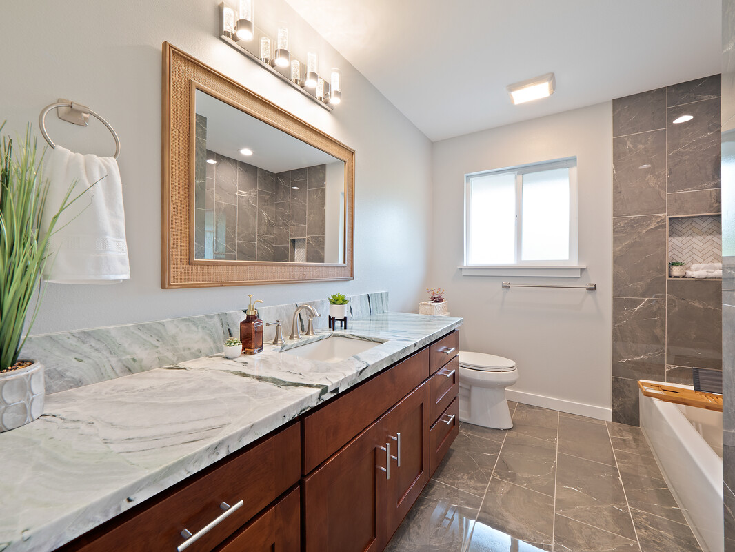 11-3155 Volcano Road Volcano, HI 96785 - Photo 14 of 25 a bathroom with a granite countertop sink mirror vanity and toilet