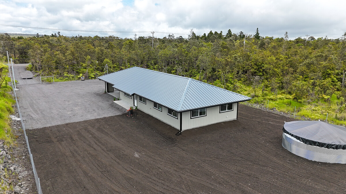 11-3155 Volcano Road Volcano, HI 96785 - Photo 21 of 25 a view of a white house with a yard and floor