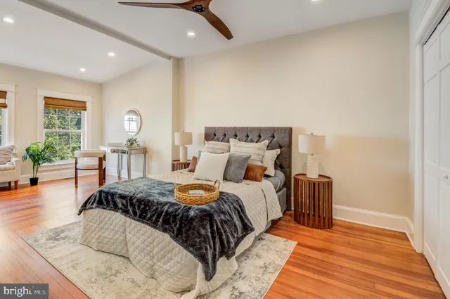 a bedroom with a bed and a dresser