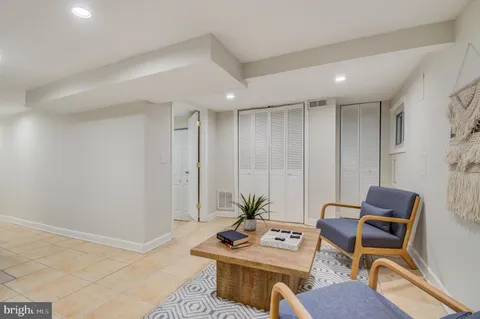 a bedroom with a bed and a lamp on table