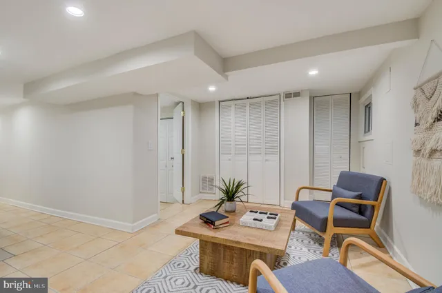 a bedroom with a bed and a lamp on table