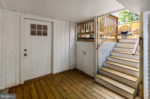 a view of a balcony with wooden floor