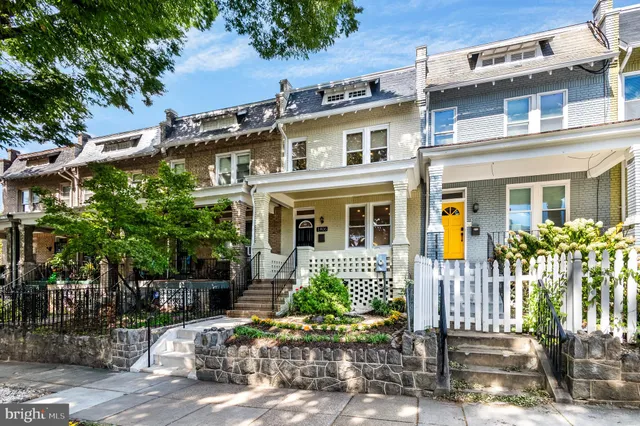 a front view of a house with a glass door