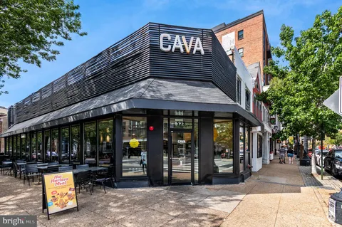 a view of a building with sitting area