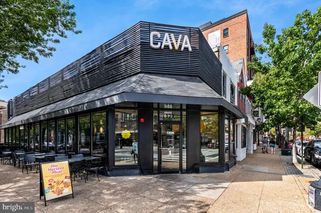 a view of a building with sitting area