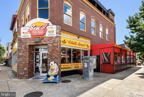 a view of shops on a street