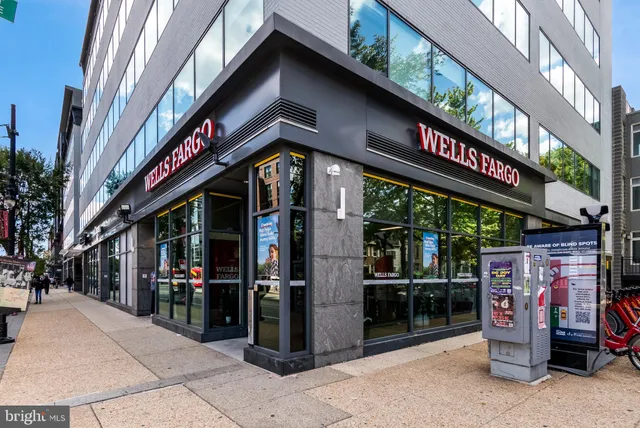 a view of a building and a people on a street