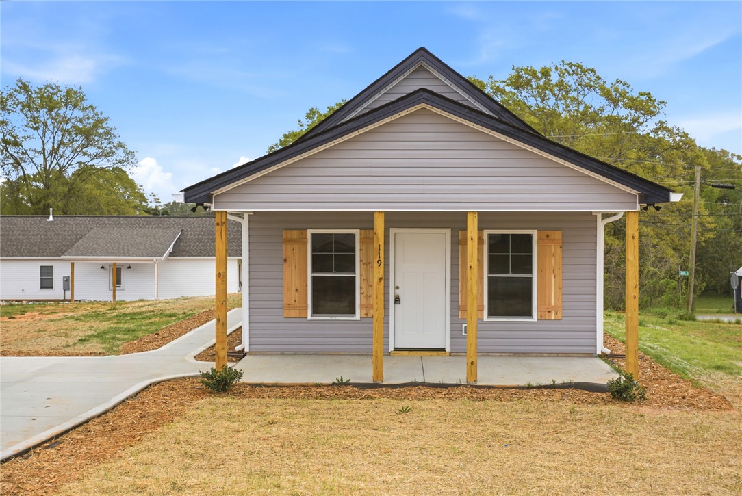 119 Riley Street Westminster, SC 29693 - Photo 44 of 44 This charming home presents an inviting facade with a welcoming front porch and clear skies overhead.