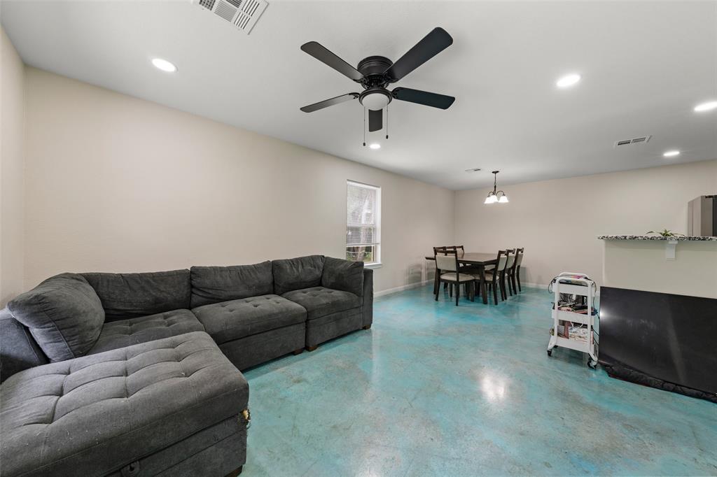 3109 North 27th Street Waco, TX 76708 - Photo 5 of 17 a living room with furniture and kitchen view