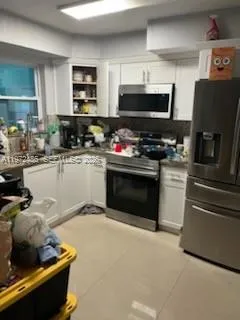 a kitchen with a stove and a microwave