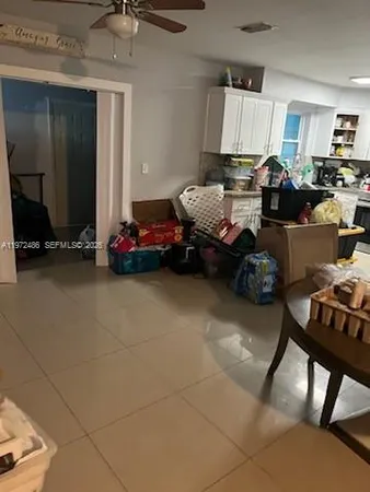 a bedroom with furniture and a flat screen tv