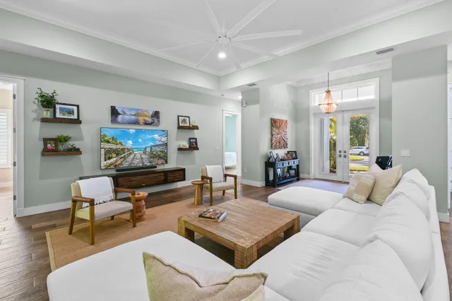 a living room with furniture and a large window