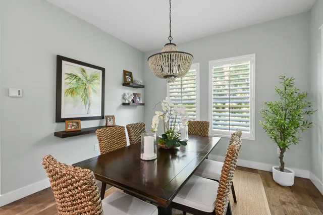 a en suite bathroom with a granite countertop sink and mirror