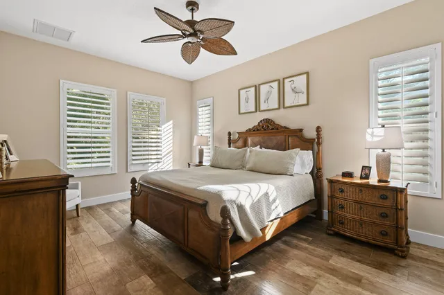 a en suite bathroom with a double vanity sink a mirror and shower